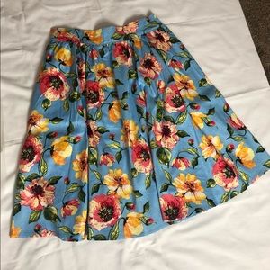 Skirt, belt, petticoat and hair scarf.